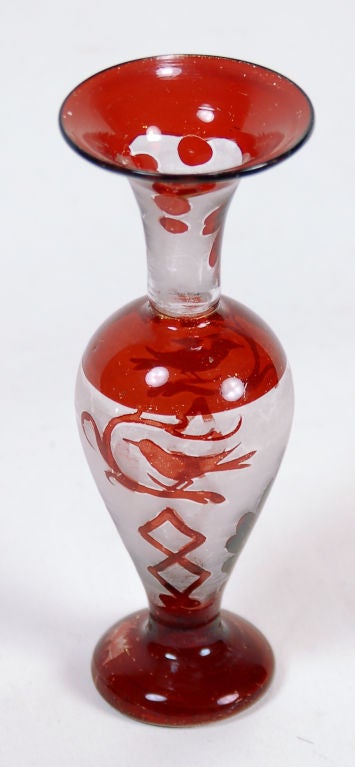 This lovely little vase has been etched and painted to mimic a cut to clear style treatment. It features a small cardinal detail on two sides. A wonderful example of depression-era art glass.