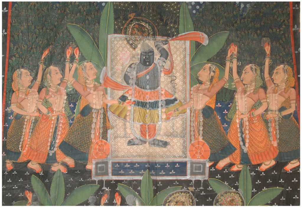 This Pichhavai or Pichwai of Gopastami, a festival of cows was created in Rajasthan India. It depicts the God Krishna as 
Shrinathji at center flanked by Gopi (cow herd girls) and a herd of cows surrounding, with flying celestials above and framed