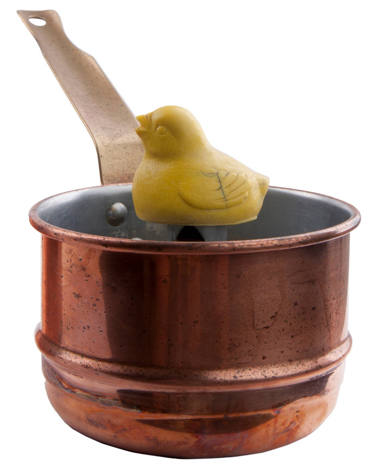 This is a REVERE WARE solid copper egg cooker with a chick that whistles when the water is hot.  It has a fill line on the bottom pot and the chick sits on a post that is marked soft, medium, hard.  The handles appear to be brass. Bottom is marked