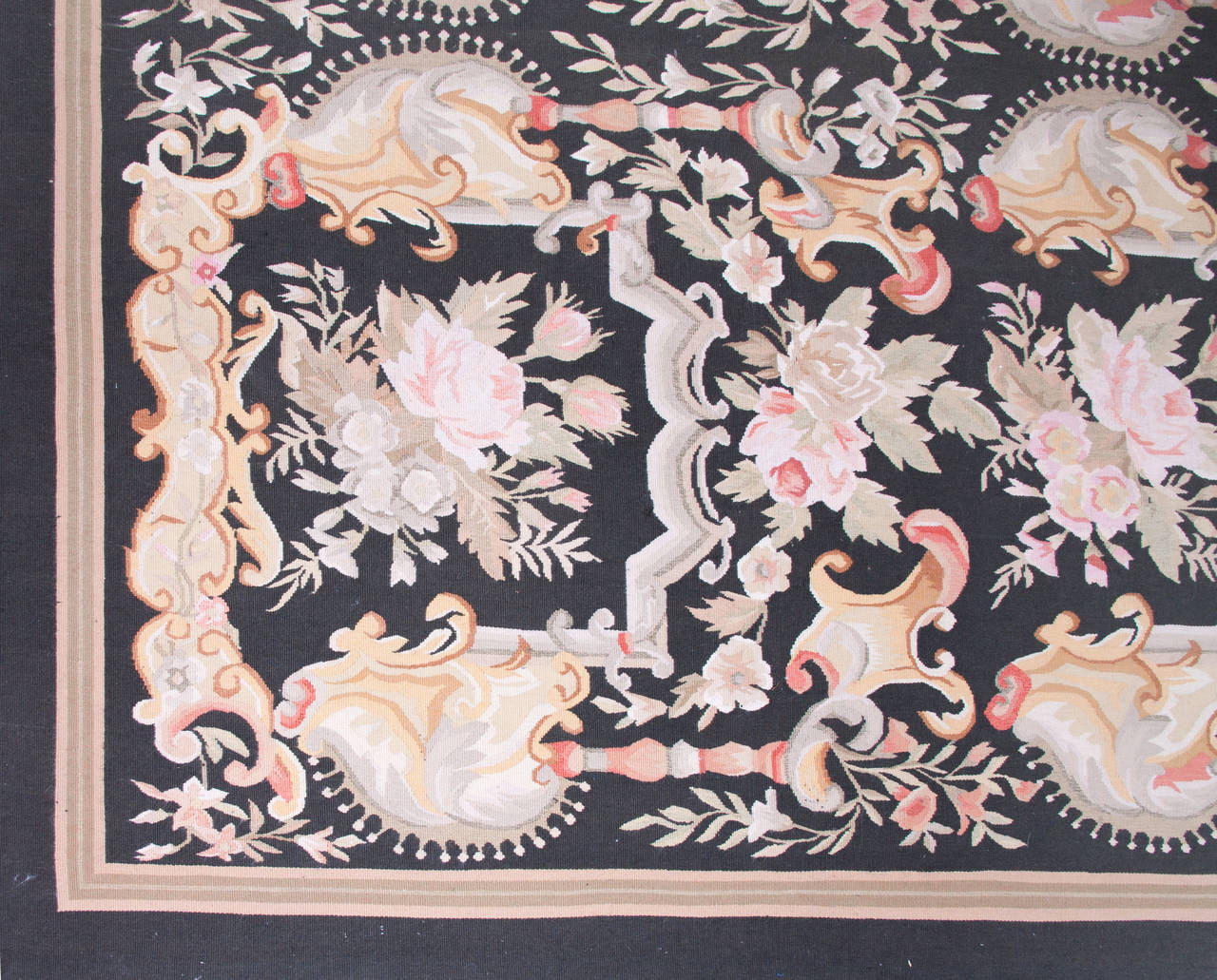 Hand-knotted rug with roses and acanthus leaves. Beautiful tan, taupe, rose colors with a light tan striped border. Spindle-framed floral has Victorian flair.
