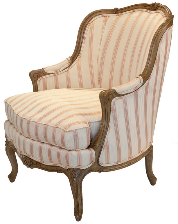 Striped taffeta upholstery with carved fruitwood motif.