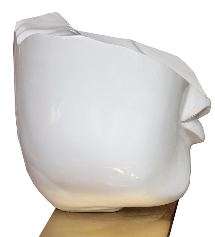 Mid Century Style Composite sculpture sits atop a highly polished brass base. Something about the lips...