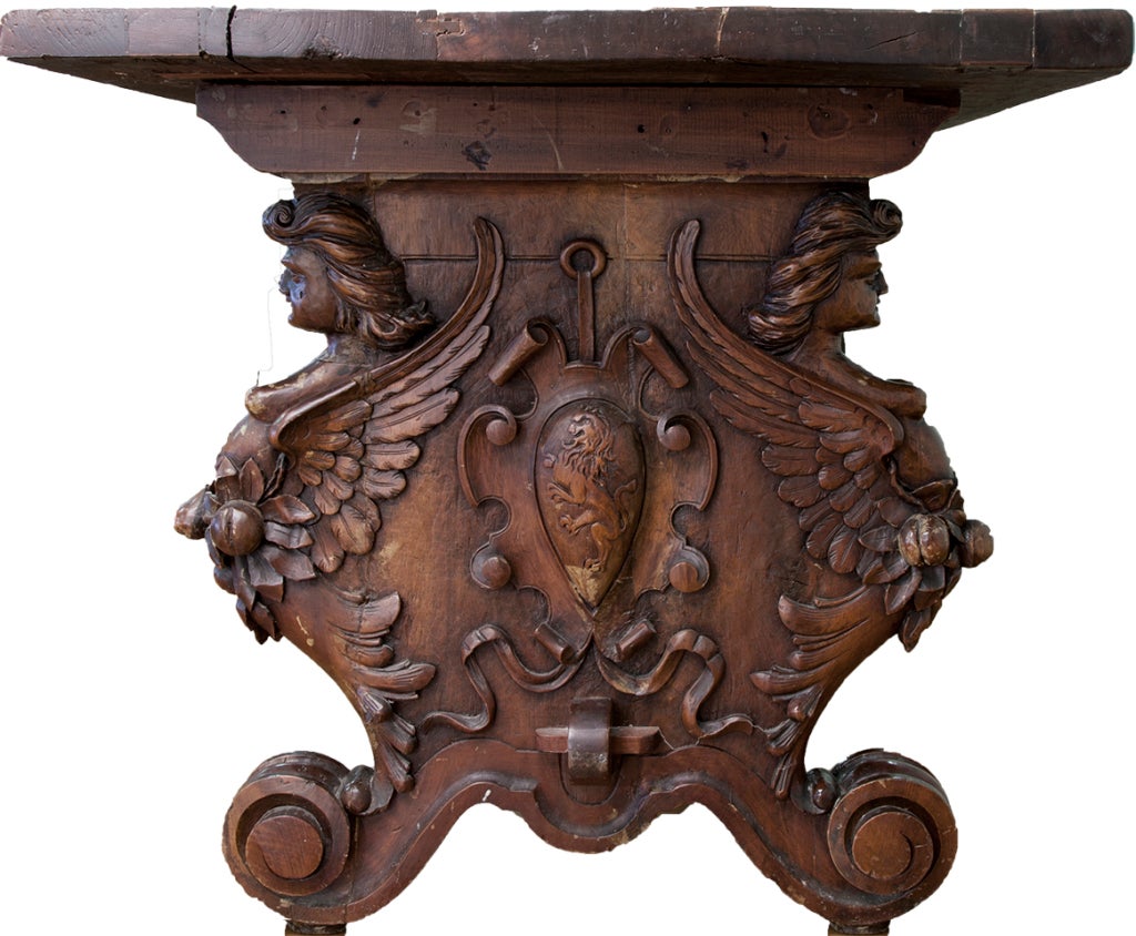 Beautiful hand -carved captain's table adorned with bare-breasted winged caryatids, lion cartouche.