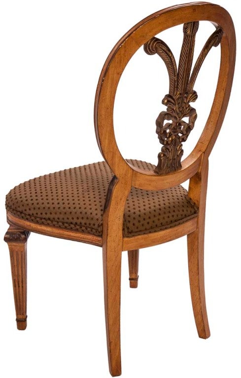 Fruitwood Shieldback chair with delicate feather and ribboning elegant diamond slant legs with olive pouf fabric.