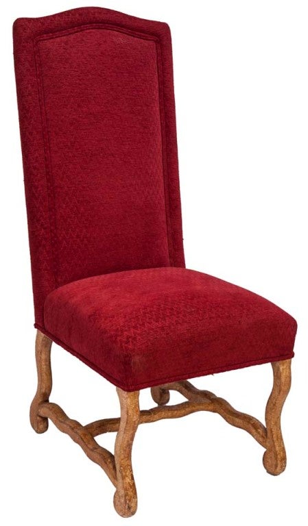 Jacobean style reproduction pair of flame-stitched red velvet chairs, are piped along high backs with flaunt mottled faux stained leg frames.