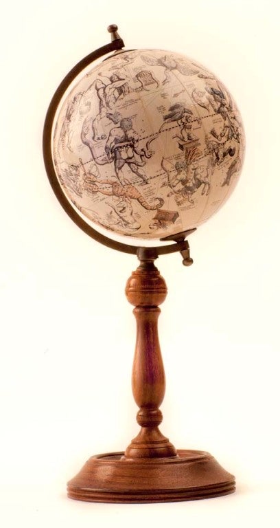 Desk-top Astrological globe with Zodiac signs on a turned-wooden stand.
