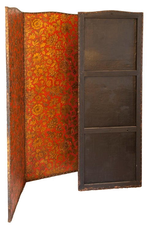 This beautiful wood and leather gold floral on red screen has an English style with an Asian influence. Stunning!