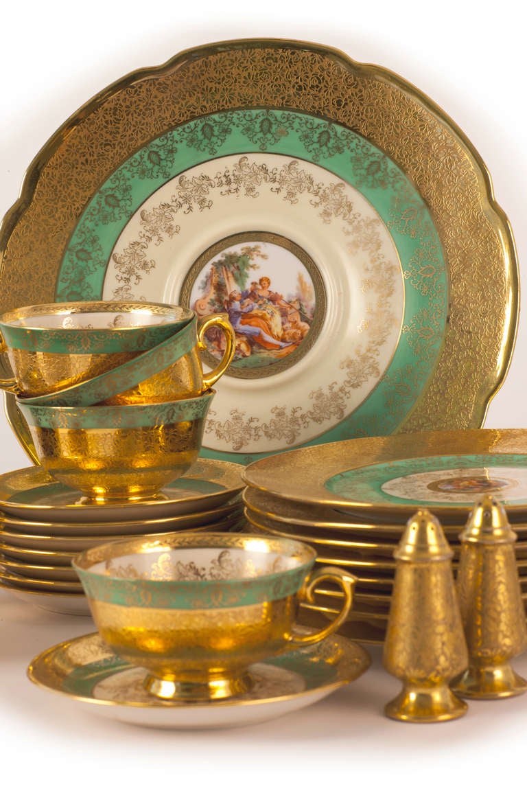This Le Mieux China Luncheon Set includes eight cups with saucers, eight luncheon sized plates, one cake plate and a pair of salt and pepper shakers. The french style decoration includes polychrome pastoral scenes with borders of white, sea green,