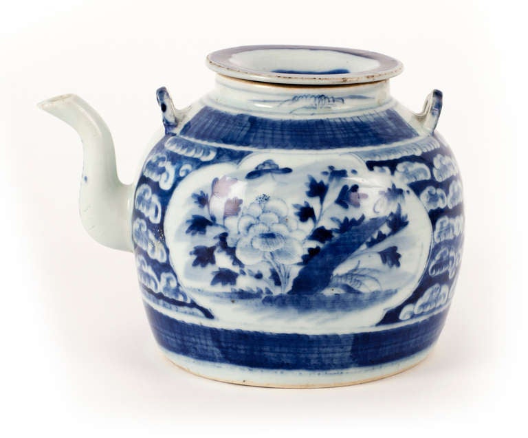 Beautiful hand-painted, floral paneled ceramic teapot from China with contrasting dish lid gives pause to one as to how this cherished pot was loved enough to justify the makeshift top. Provenance SC private collection.
