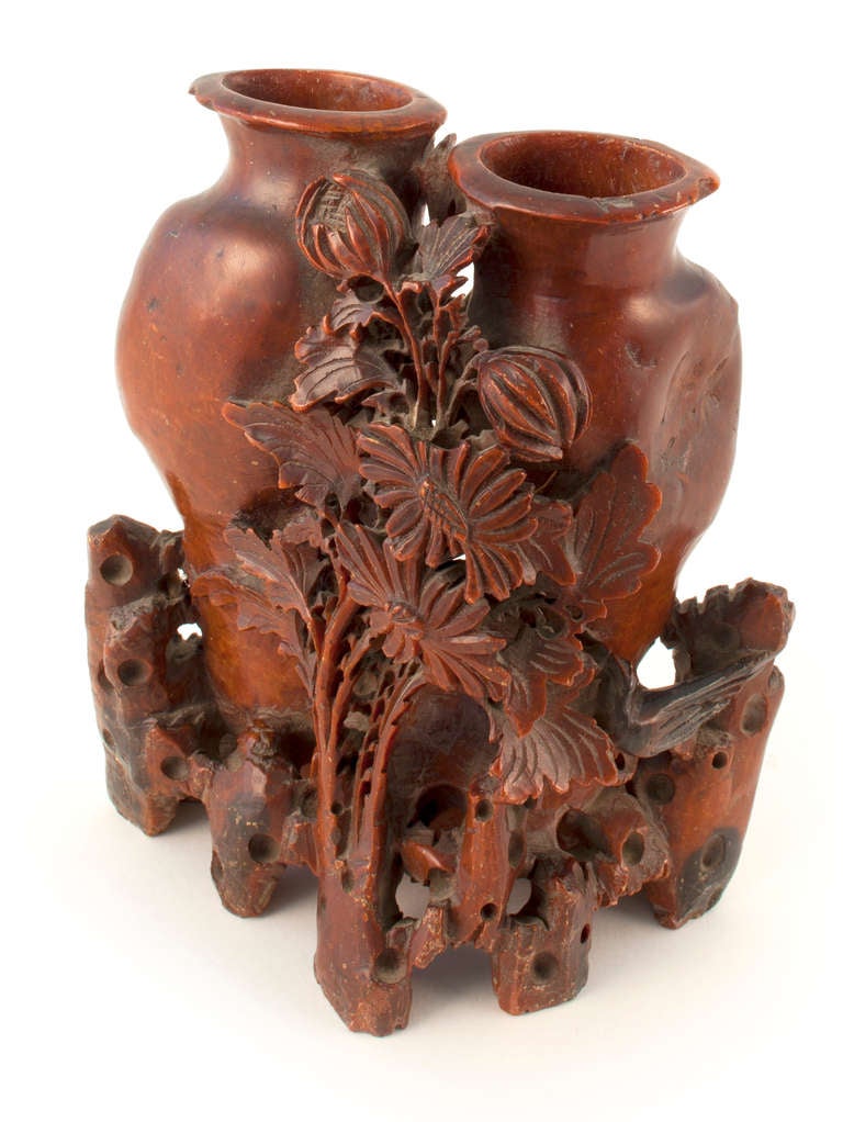 Antique Asian red stone double carved vase with floral motif.