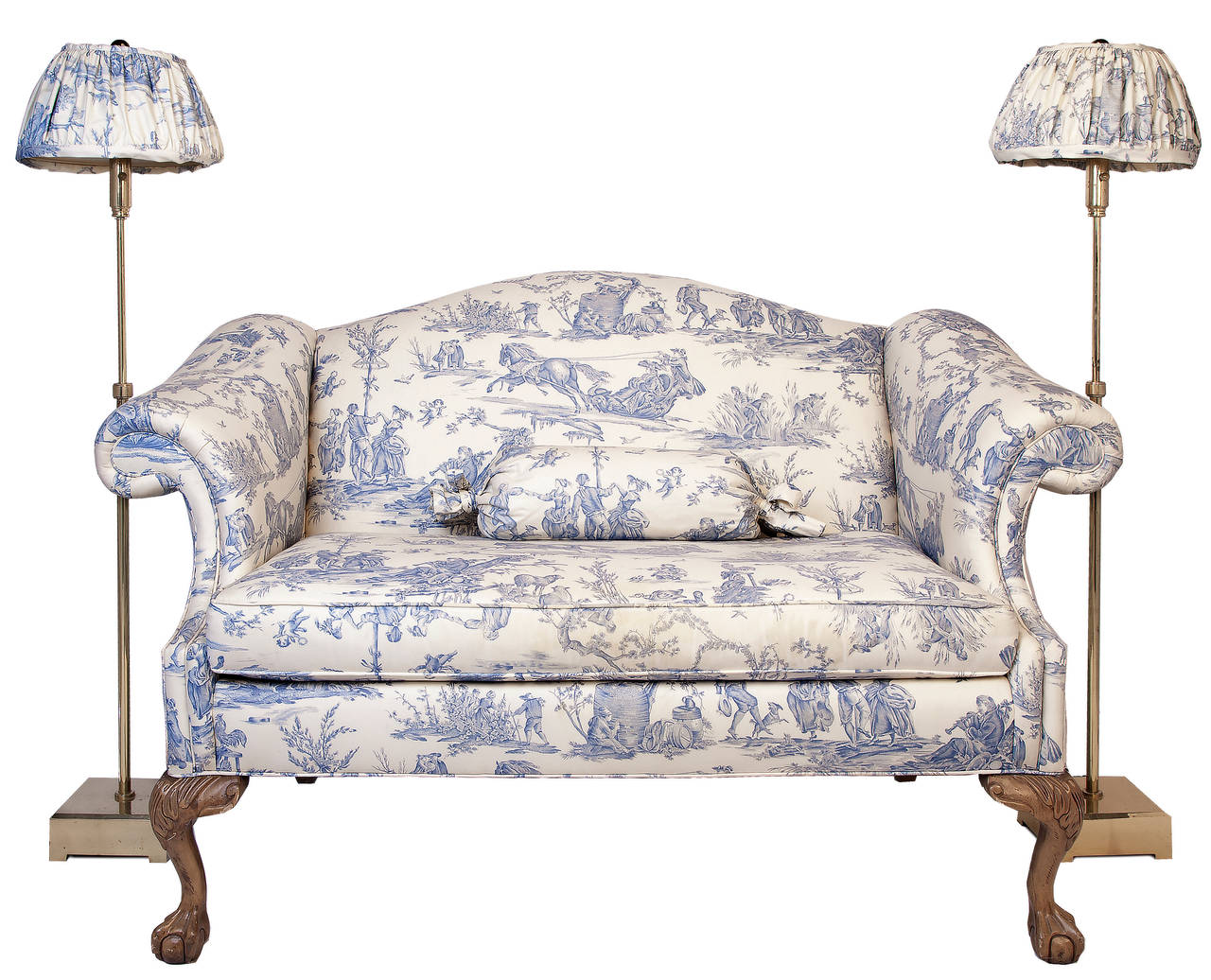 Blue on cream toile with french country scenes uphosters this camel back loveseat with carved ball & claw front feet. Shirred lampshades on the adjustable height lamps are in the matching toile, suite also includes custom made round table skirt and