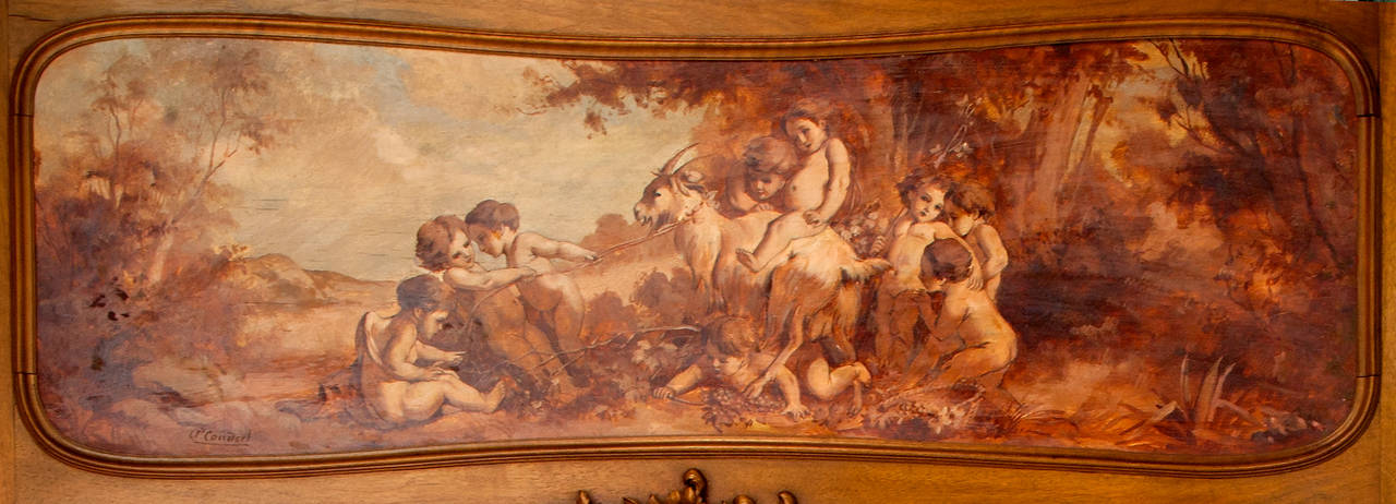 This lovely Second Empire trumeau mirror in carved French walnut with shaped, bevelled mirror and beautiful painted panel in sepia tones depicting classical putti in the style of Louis XV with artist's signature (please see detail shot) By A'