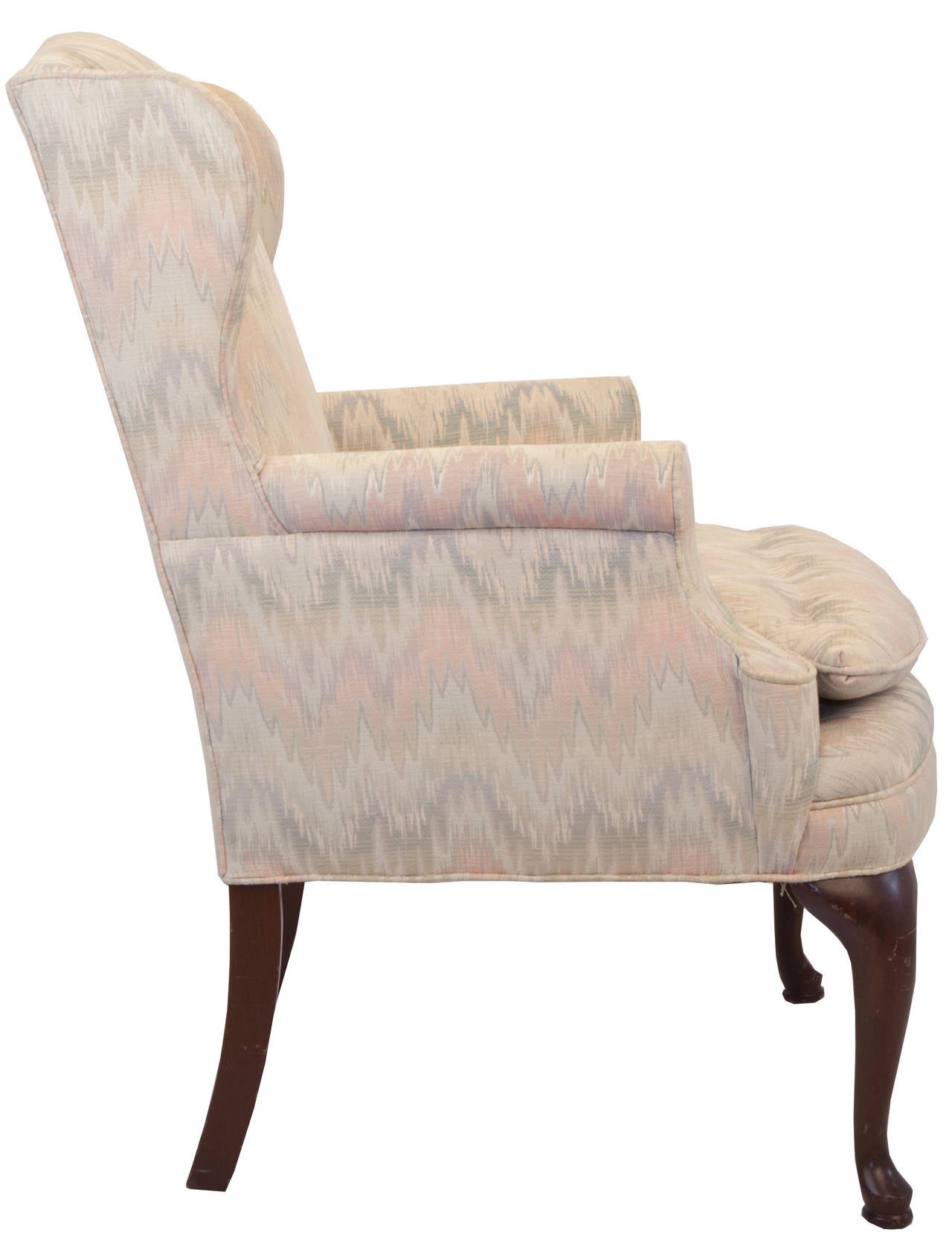 Ladies scale wing chair with carved mahogany pad feet on the front legs, square curved legs on the back. Uphostered in pointe d'hongrie (flame stitch) tapestry in soft celedon and dusty rose. Loose seat cushion with buttons, scrolled arms with