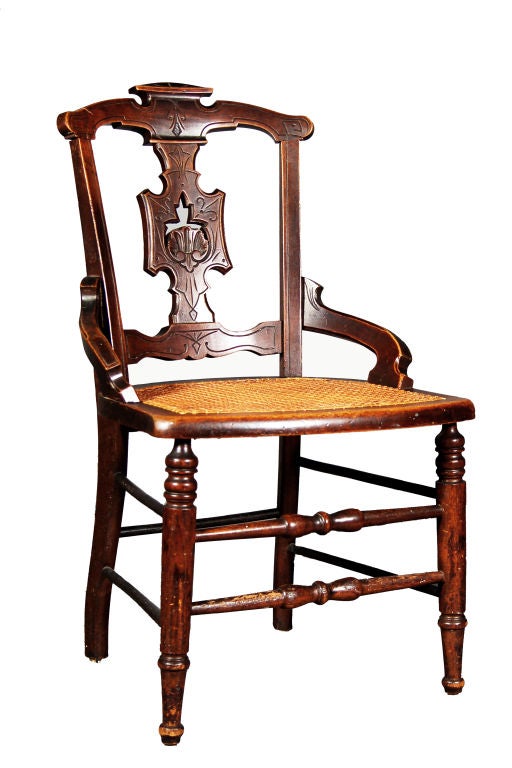 Early Victorian East Lake Elegance. Hand carved back with a new cane seat. 

The seat back is an exquisite example of the popular East Lake style of the early Victorian Period. It's light and airy detail exemplifies the movements towards the heavy