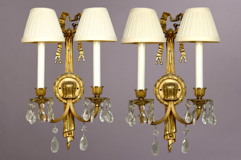 Beautiful pair of gold leaf crystal candelabra wall sconces.