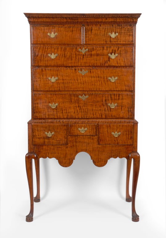 A vibrantly figured Queen Anne flat top high chest, New Hampshire, Circa 1750-60.

This handsome high chest features richly grained tiger maple, excellent proportions and superb regional characteristics. It retains an excellent patina and fine