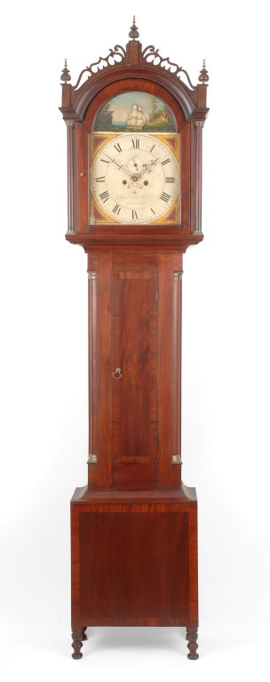 An impressive Federal mahogany tall case clock with rare rocking ship dial by James Cole, Rochester, New Hampshire, circa 1820.

This case is attributed to cabinet maker Abraham Forsskol of Saco, Maine and offers a great deal of folk appeal