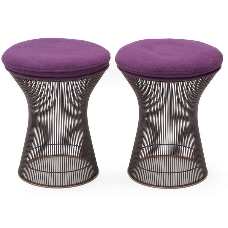 A good pair of corseted stools rendered in nickel-plated steel rods from Warren Platner's iconic series for Knoll. These stools retain their original exuberant purple upholstery.