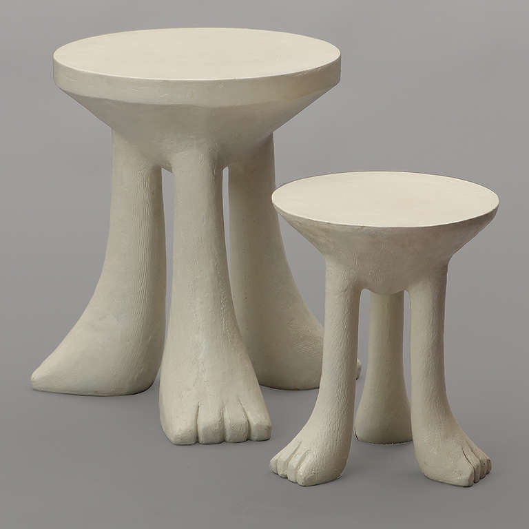 A fine and highly original three-legged African stool or end table made of painted fiberglass.