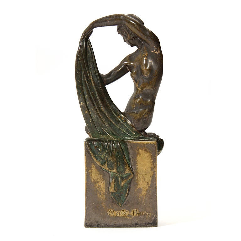 A cast bronze sculpture with original markings. Stamped 