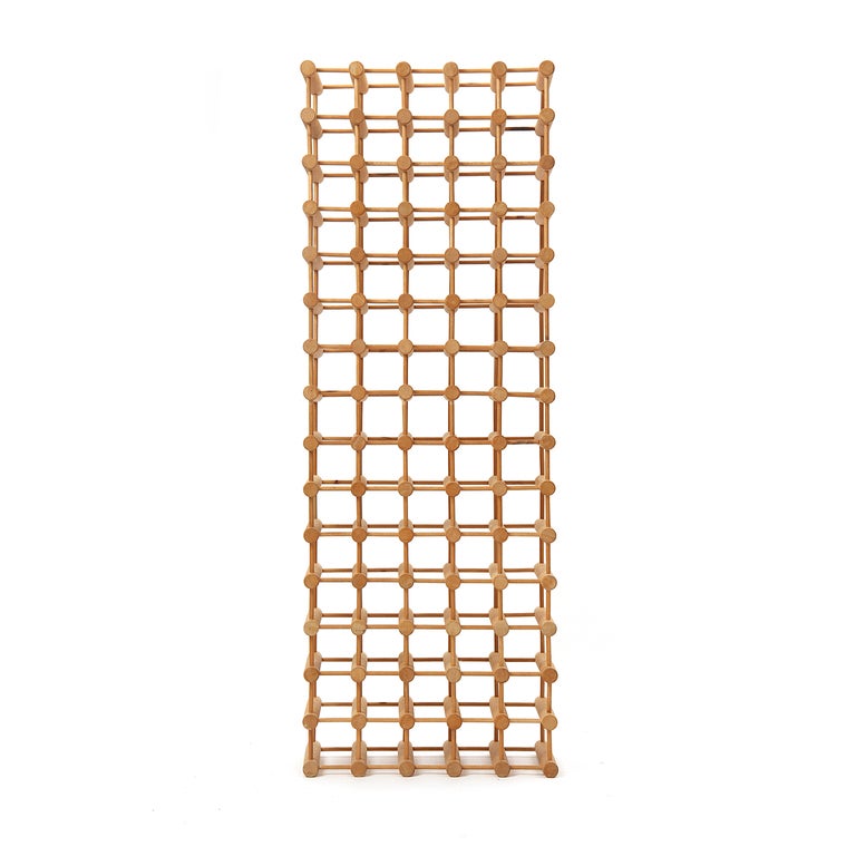 Two dowel sizes comprise this modular wine rack system. Smaller dowels are pressed into pre-drilled holes in the larger ones providing sturdy and demountable storage. The unit can be configured to fit your space --- even assembled into 2, 3, or 4