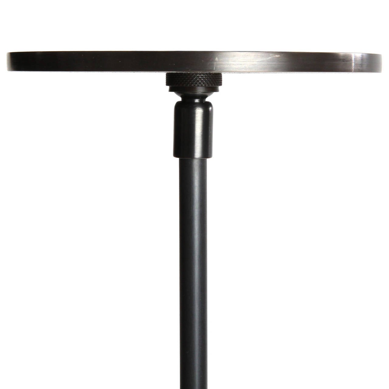 A spare and refined pendant lamp having a single Edison bulb attached to a nickeled steel rod and mounting plate.