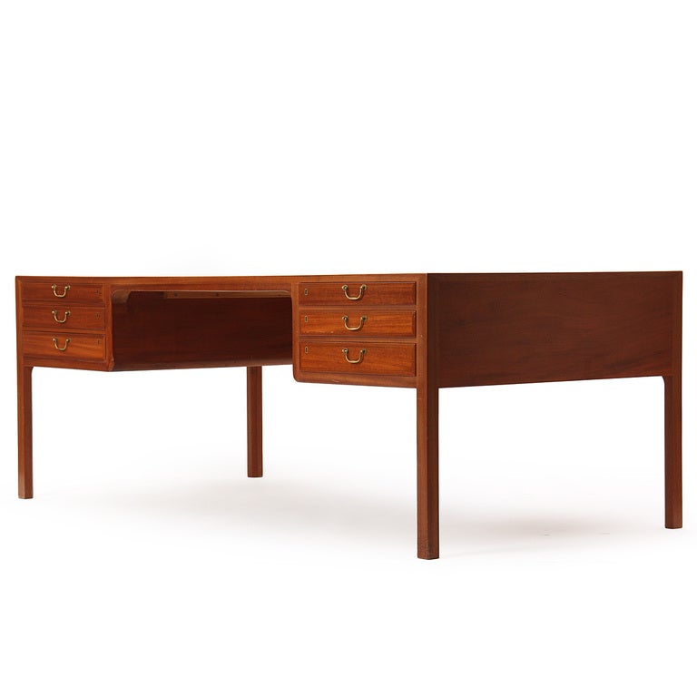 A quarter-sawn Cuban mahogany desk with six drawers and four concealed storage compartments. Design by Ole Wanscher, cabinetmaker A. J. Iversen