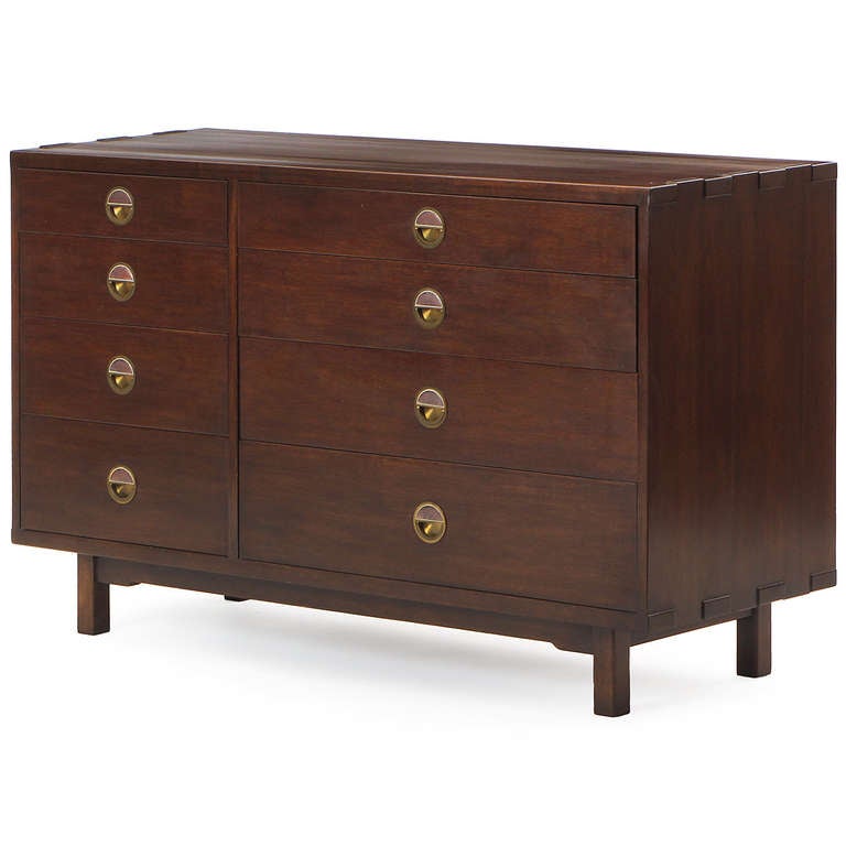 A magnificent and finely crafted eight (8) drawer dresser. Features an interesting overlapping joint detail to top and expressive ceramic tiles by Otto and Gertrude Natzler set into the brass ring pulls.