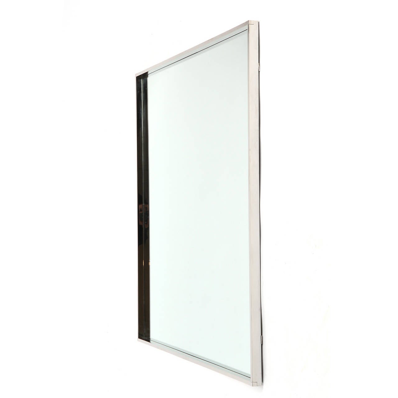 A refined and minimalist custom wall mirror of impeccable quality, featuring a handmade lap-joined frame made of heavy gauge nickel plated bronze. Designed and manufactured in New York by Wyeth, 2013.