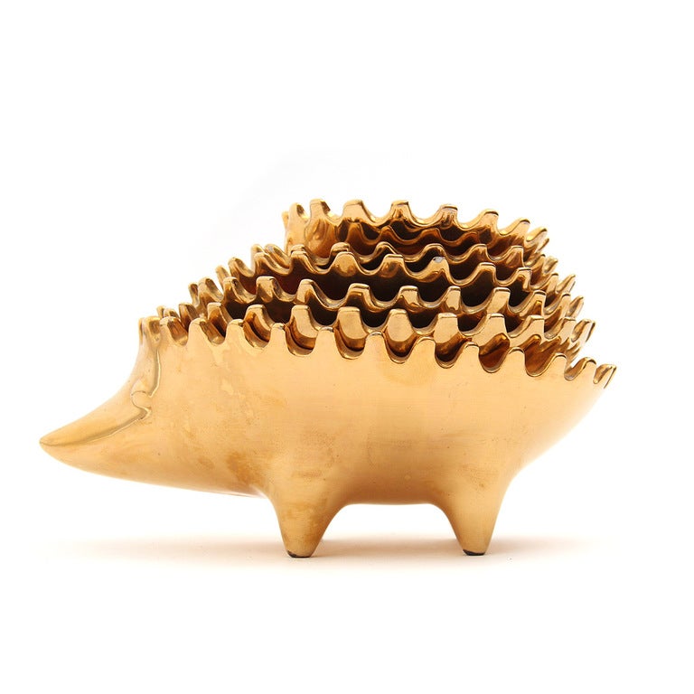 A set of over-sized porcelain and gold glaze stacking hedgehogs in the style of the classic Walter Bosse bronze ashtrays.