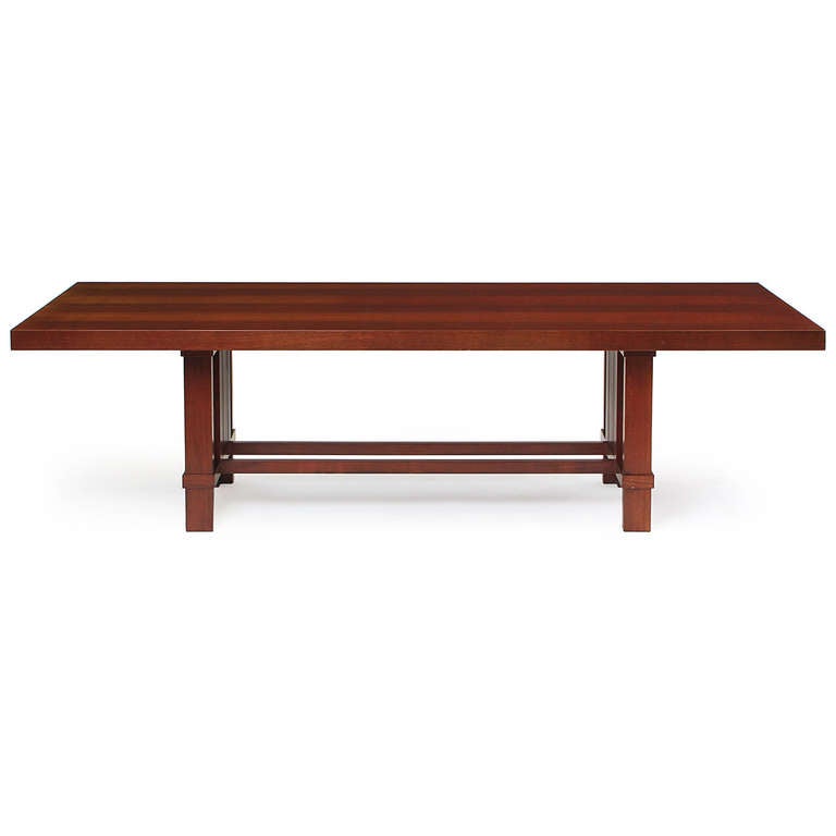 An elegant and generously scaled dining table in cherry with slatted sides and paired stretchers. This table is from the estate of Ed Koch, former mayor of New York City.
