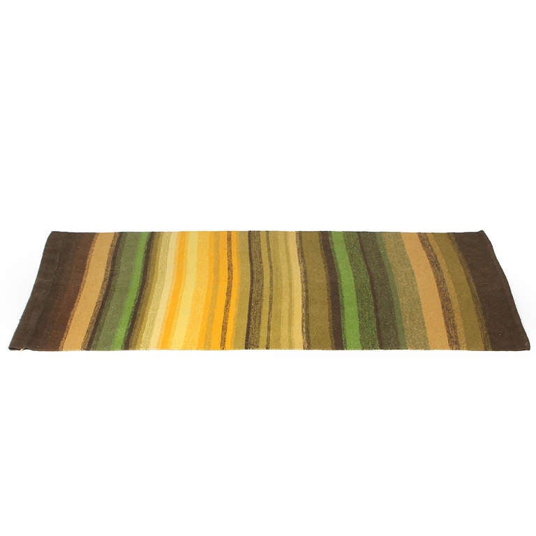 A fine and unique hand loomed striped tapestry having an interesting and varied palette of earthy browns, yellows, and greens.