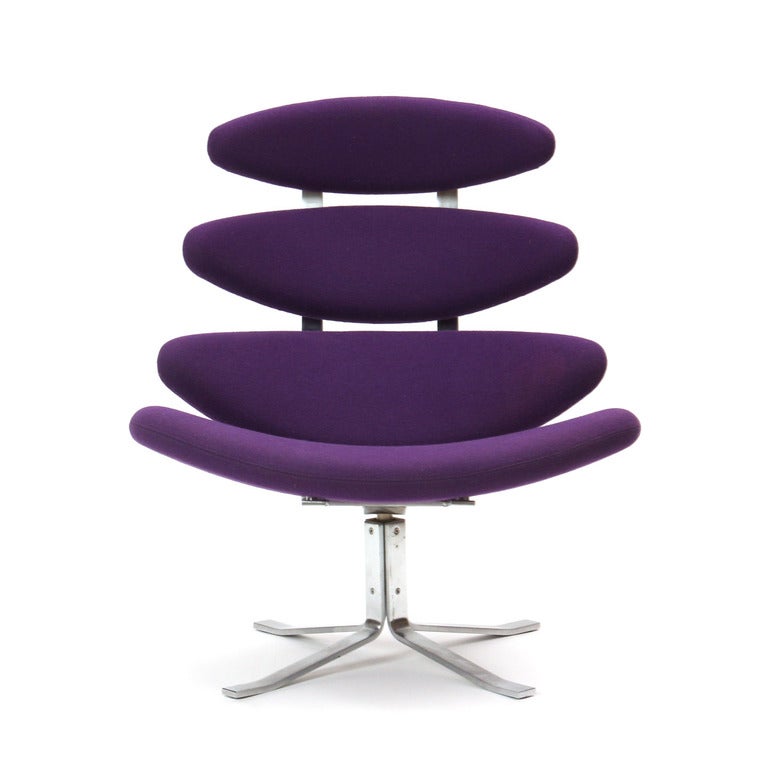 A unique lounge chair with a satin chrome frame and four attached cushions resembling vertebra in original purple wool upholstery.