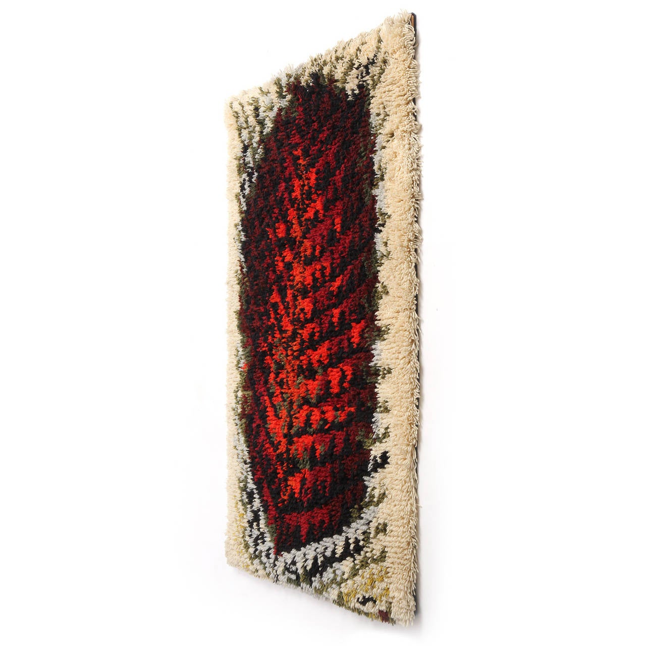 A fine handmade Rya rug or wall hanging having an expressive abstracted shape, masterfully loomed with a thick pile in a rich palette of cream, grey, russet, black, red, blue and burnt umber.