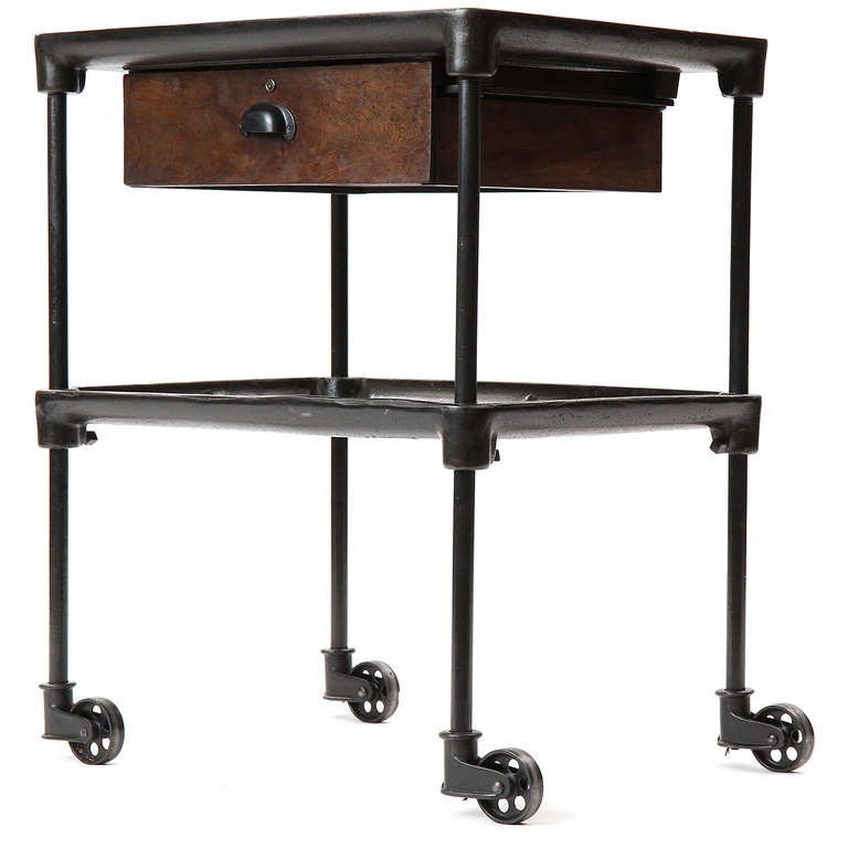 A great version of a cast iron industrial workman's machinist cart with original right angle casters and a unique, rough hewn, oak drawer.

Height can be modified by WYETH.