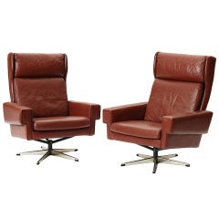 pair of swivel armchairs