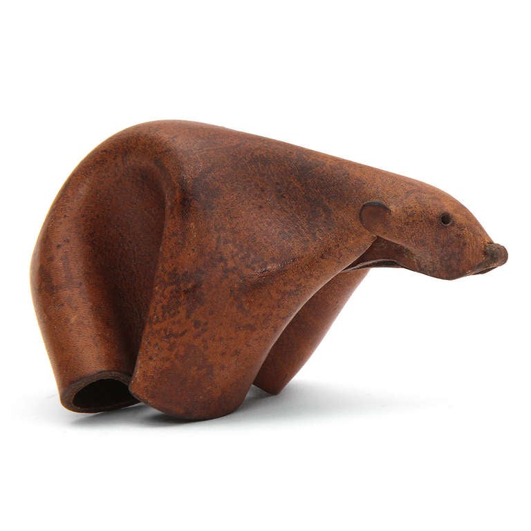 A delightful and expressive polar bear ingeniously formed from a single sheet of folded, pinched, pressed and cut natural leather.