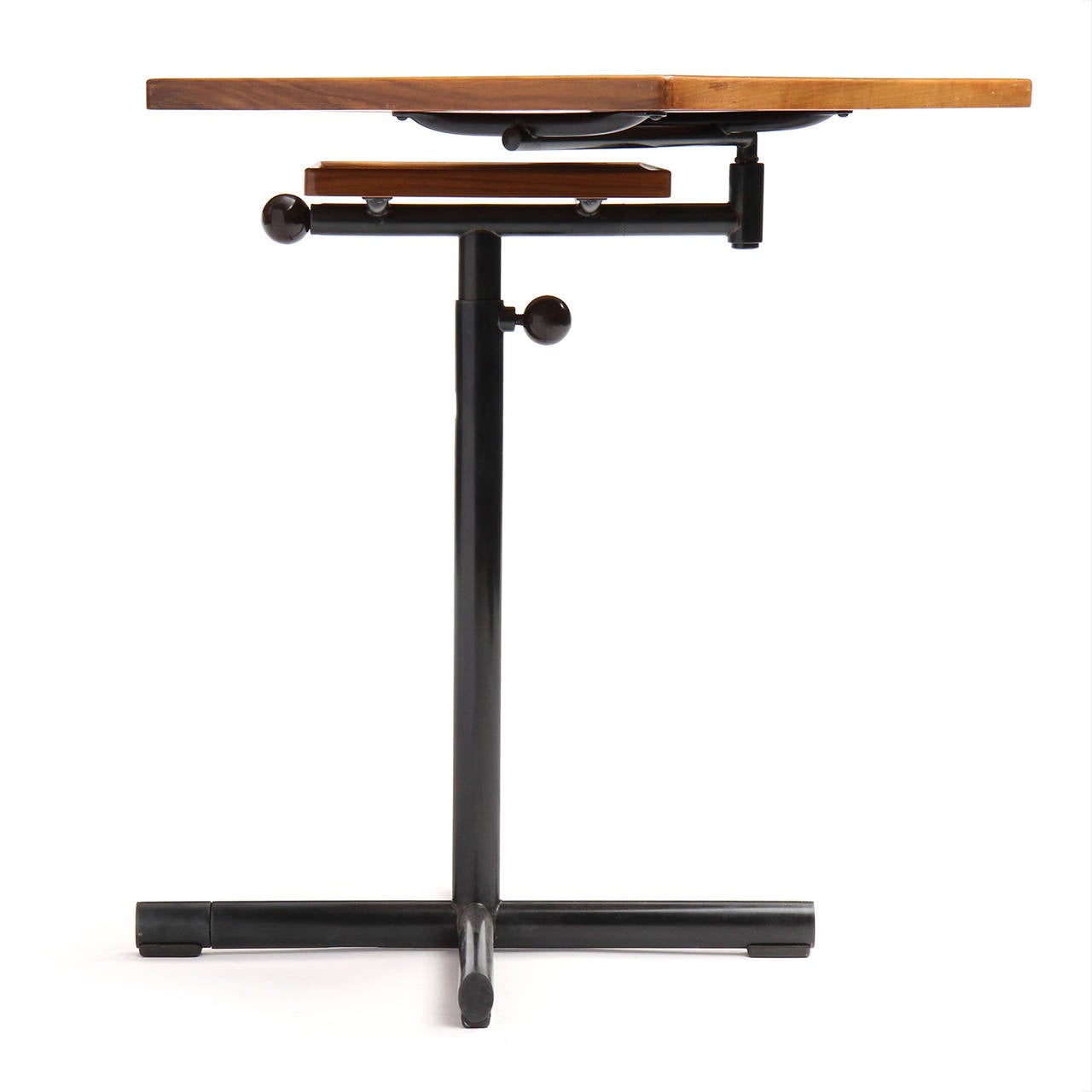 A beautifully engineered and highly adjustable two-tiered utility table having a pivoting and tilting top surface attached to a copper-plated steel cruciform base.