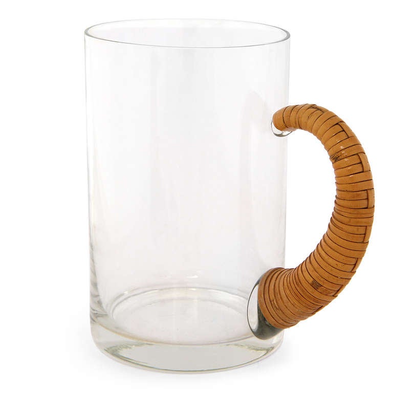 A pair of uncommon handmade glass beer steins having impeccably cane wrapped curved handles.
