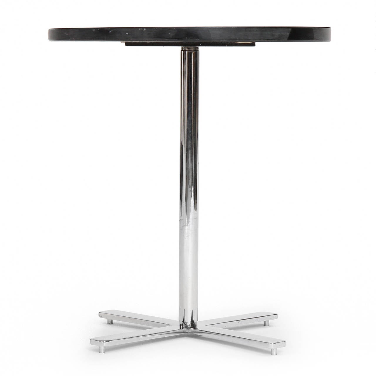 A refined, minimalist and excellent quality occasional or side table having a circular polished slate top floating above a polished chromed steel stem on a cruciform base.
