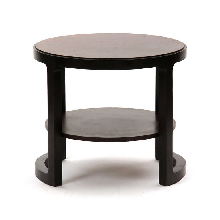 A continuous-framed, sculptural two-tiered end/occasional table by Edward Wormley for Dunbar.