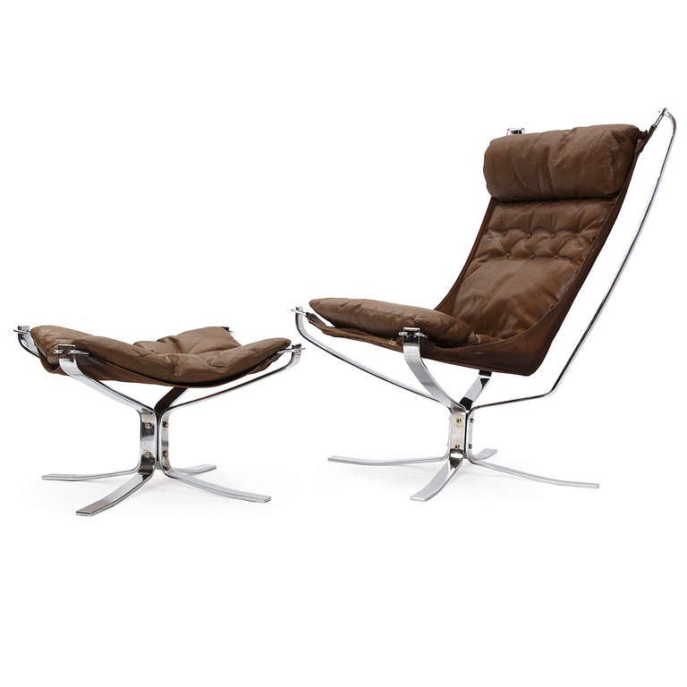 An innovative lounge chair and ottoman having a sculptural chromed steel frame supporting a suspended sling seat with down filled leather cushions.
