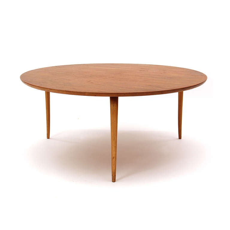 An end table with a round teak top that rests upon sculptural beech bentwood legs. Signed and dated.