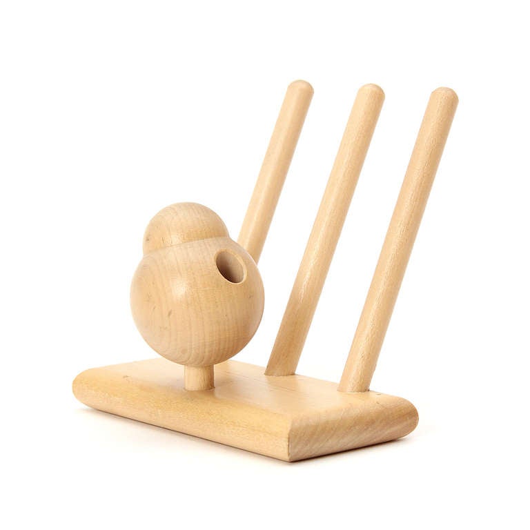 A pensive bird pen and note holder crafted from birch.