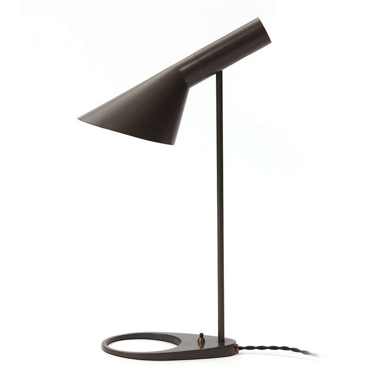 A black metal desk lamp, with a pivoting 