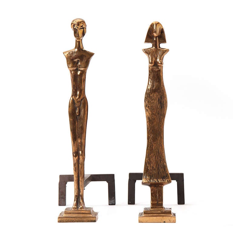 A Giacometti-inspired andiron set incorporating finely cast male and female bronze abstracted figures.

Tools measure 8