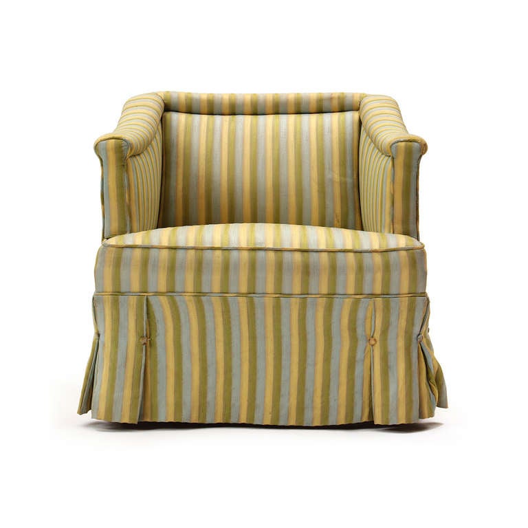 An elegant and  generous pair of striped silk and down upholstered skirted near slipper chairs by Dunbar, circa 1940s.