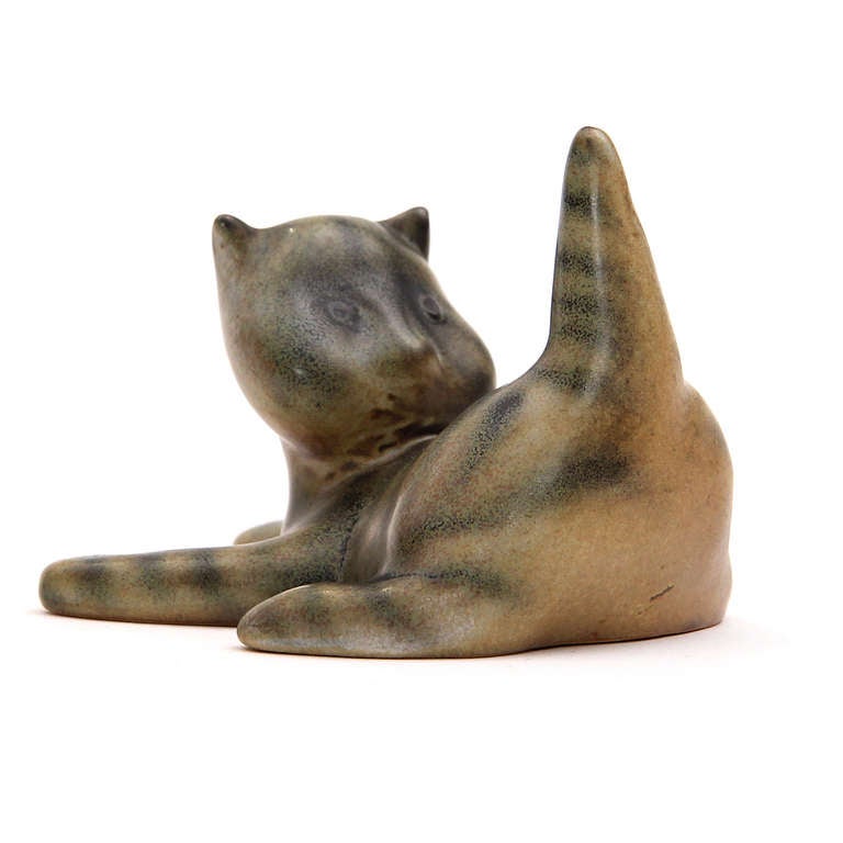 An expressive, whimsical and finely modeled ceramic figure of a cat designed by the artist Michael Schilkin for Arabia pottery of Finland.