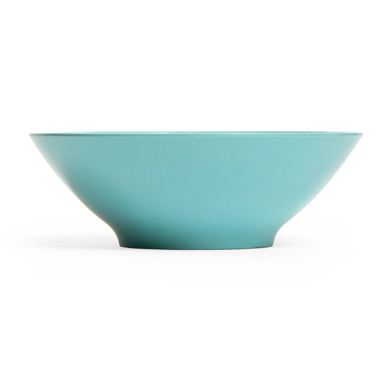 A molded sea foam blue melamine bowl in the Florence pattern from the Prolon series designed for George Nelson and Associates.