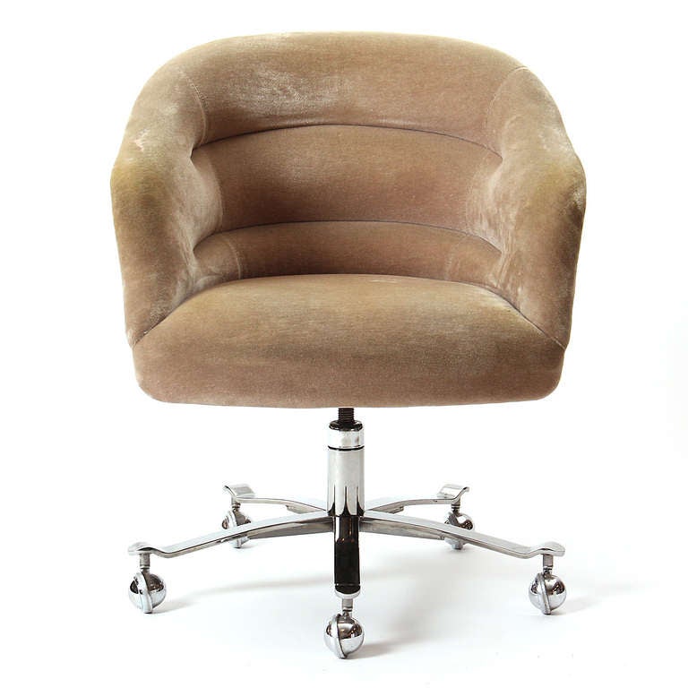 An adjustable height barrel-back desk chair with channel-stitched camel mohair upholstery, on a five-point base with omnidirectional chromed casters.